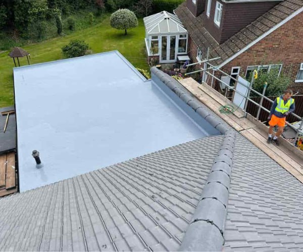 This is a photo of a newly installed hip roof, with a combined liquid covered flat roof. Work carried out by CGT Roofing Newport Pagnell