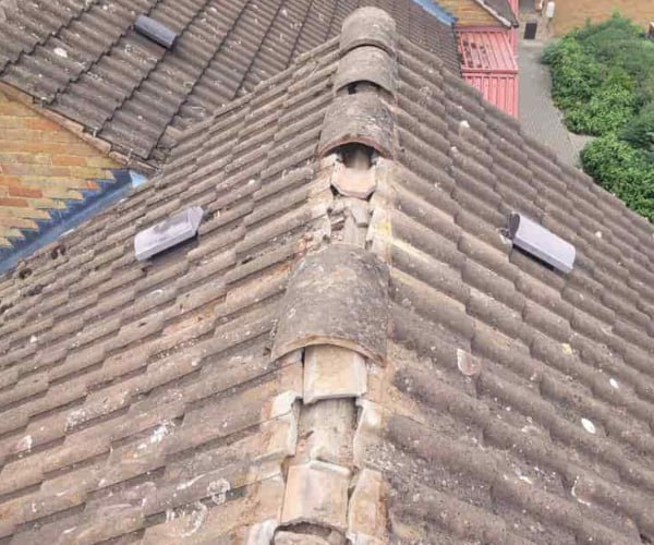 This is a photo if a roof ridge which has missing tiles. The ridge tiles are being replaced by CGT Roofing Newport Pagnell